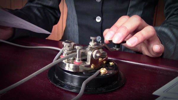 close-up of hand on telegraph key
